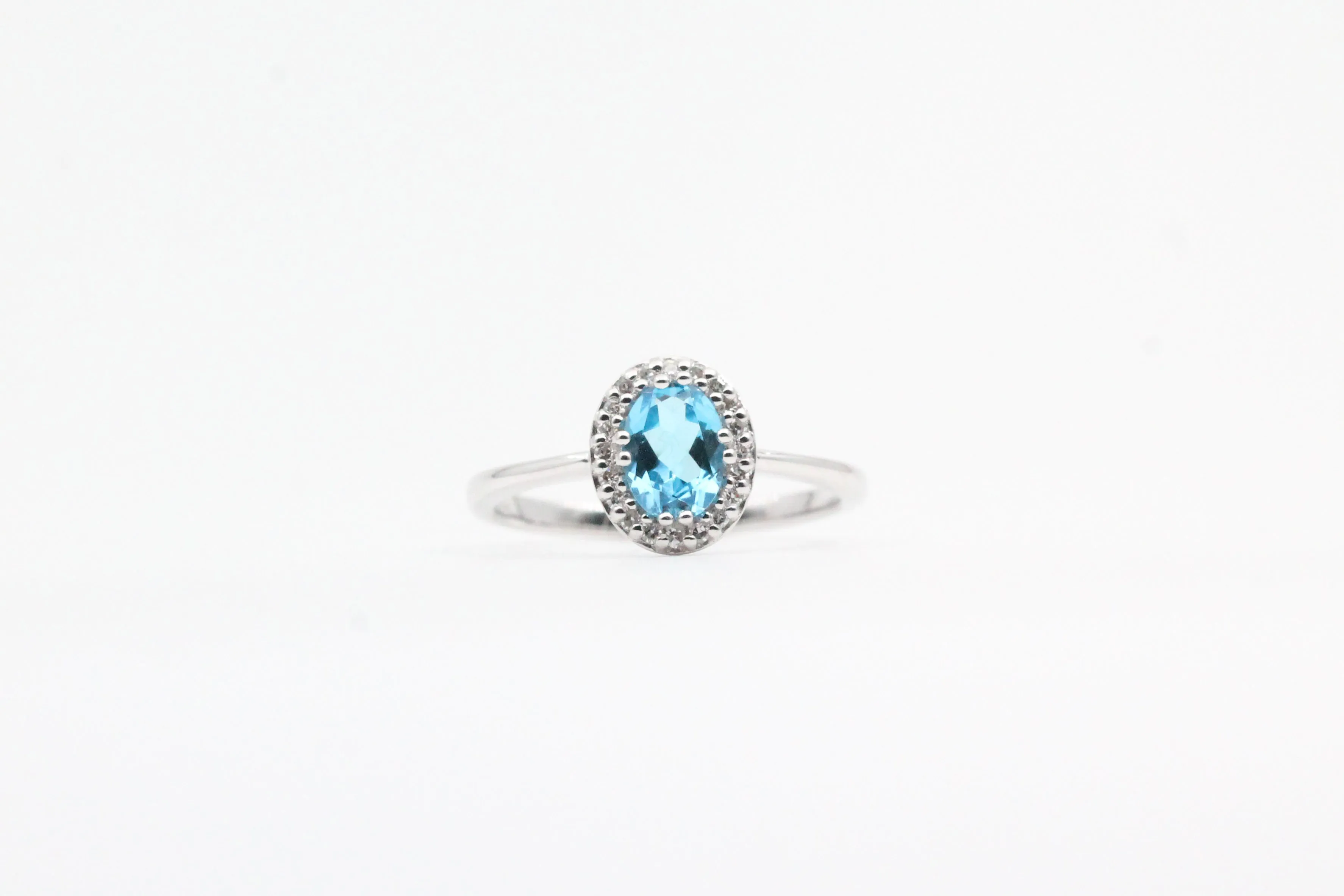 White Gold Blue Topaz Halo Ring
