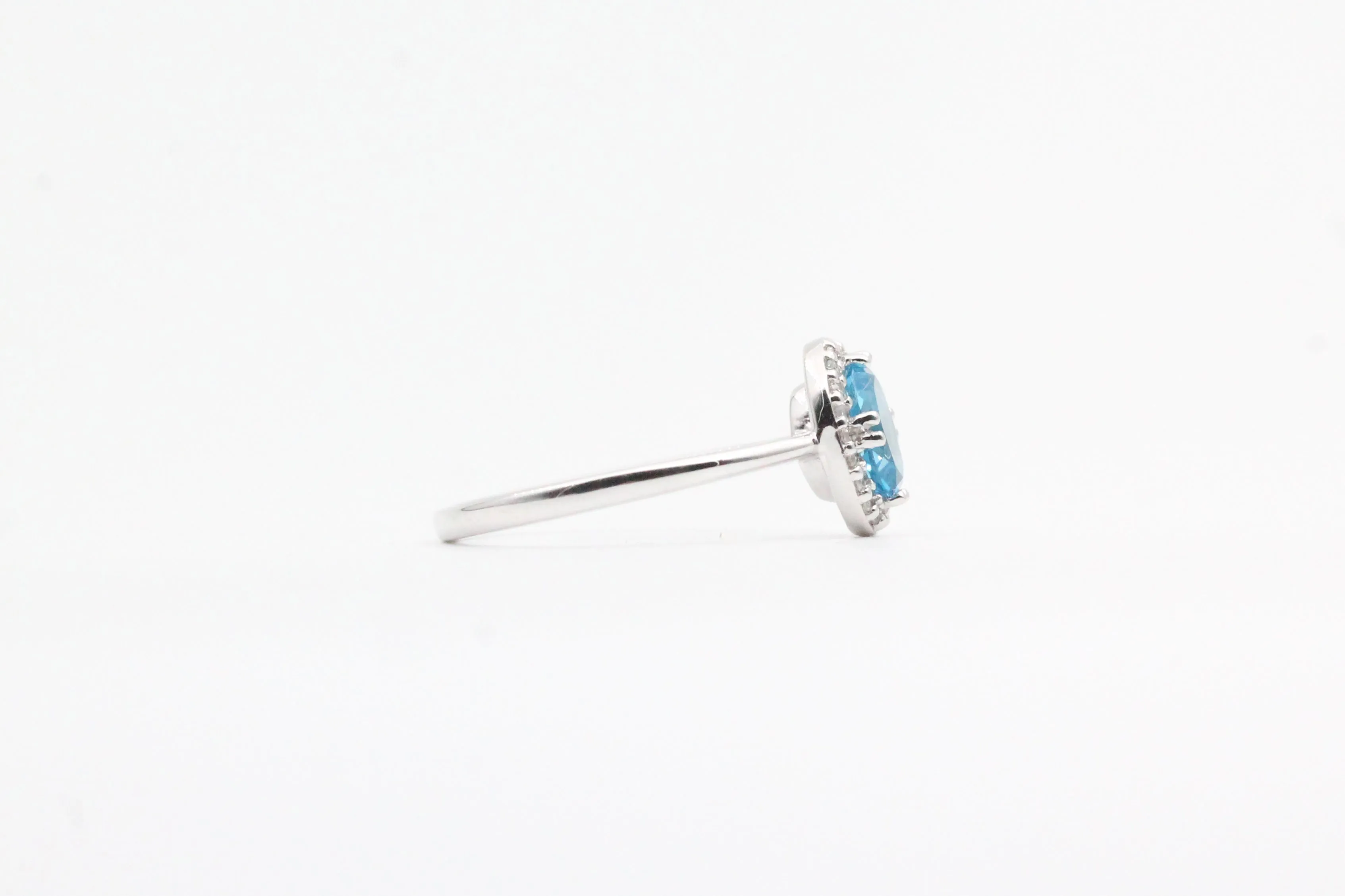 White Gold Blue Topaz Halo Ring